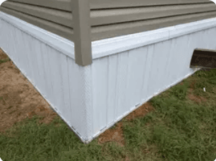 Completed white vinyl skirting corner detail after installation