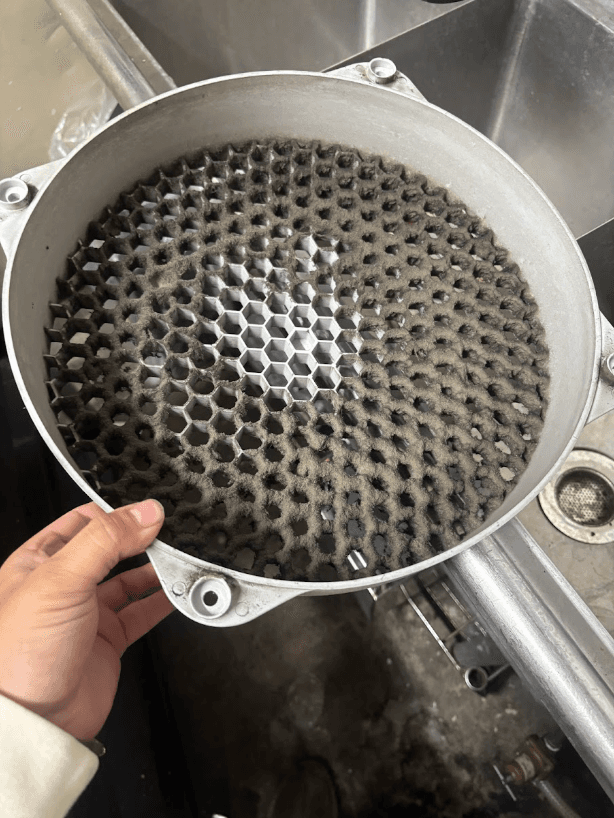 Commercial kitchen hood filter before and after cleaning